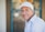 man smiling while sitting