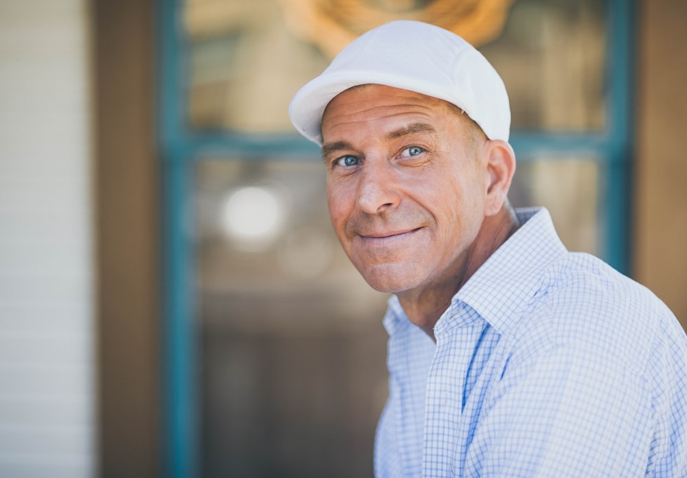 man smiling while sitting