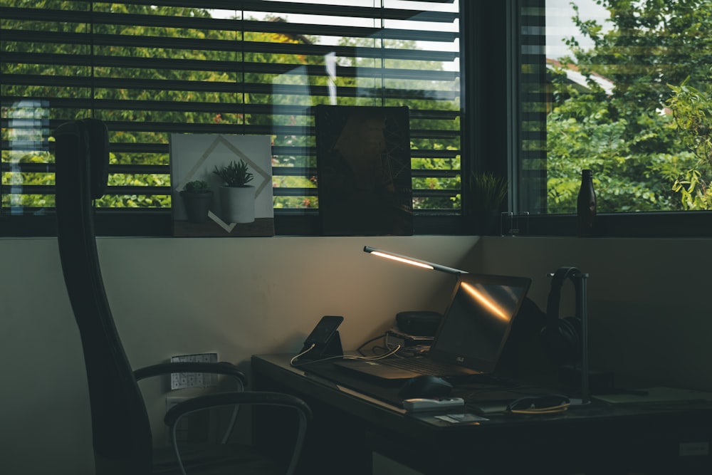 black rolling armchair near brown wooden desk