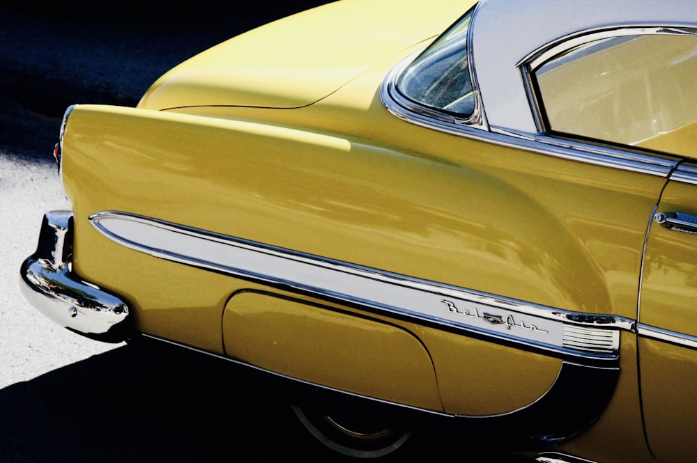 vintage yellow car under sunny sky