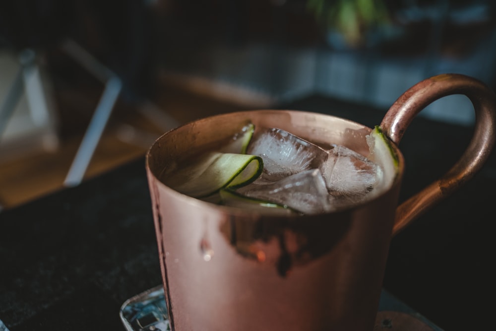 brown mug with iced beverage