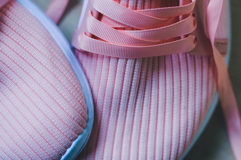 pair of pink-and-white low-top sneakers