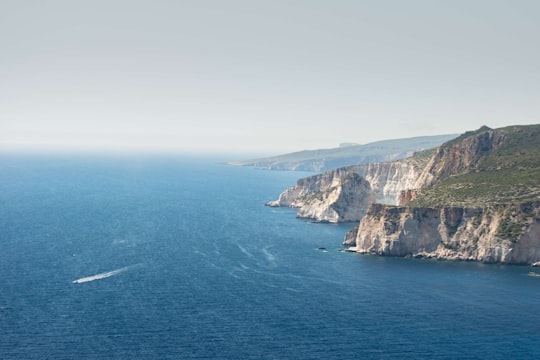 aerial photography of body of water and mountain in Navagio Greece