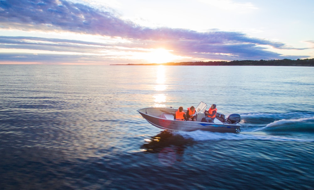 people riding on bow rider