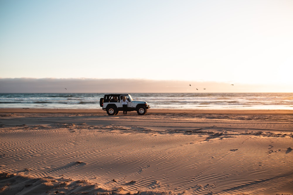 white wrangler beside the beach