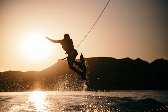 Wakeboarder at golden hour on a lake