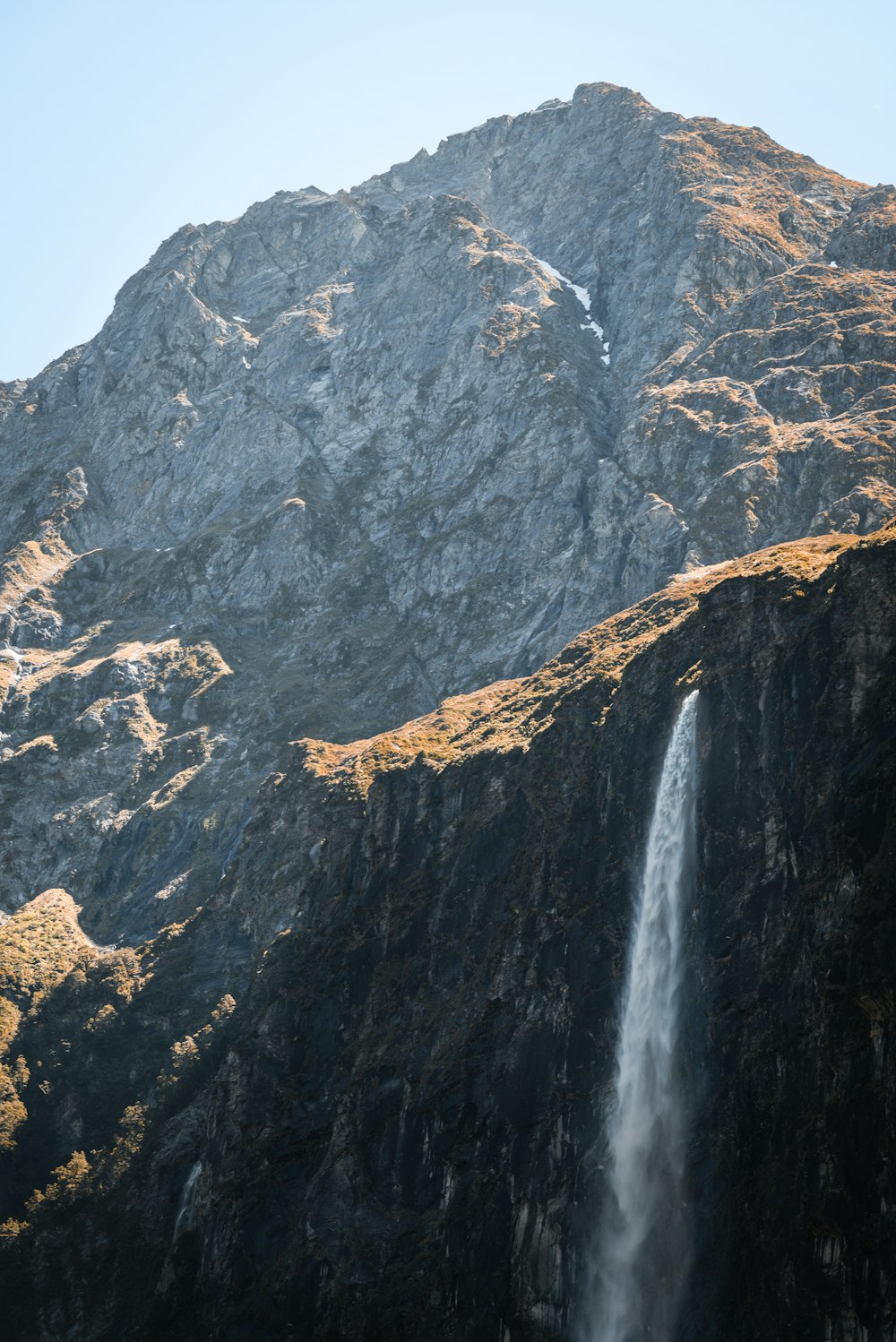 waterfalls front of gray rock formation