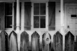Side-by-side photos showing an old weathered fence replaced by a new, sturdy privacy fence.