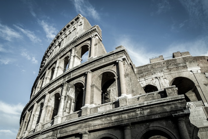 low-angle photo of The Colosseum in Ancient Rome