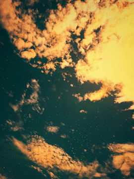 A crowd in deep reflection under a sky lit by divine light and distant stars.