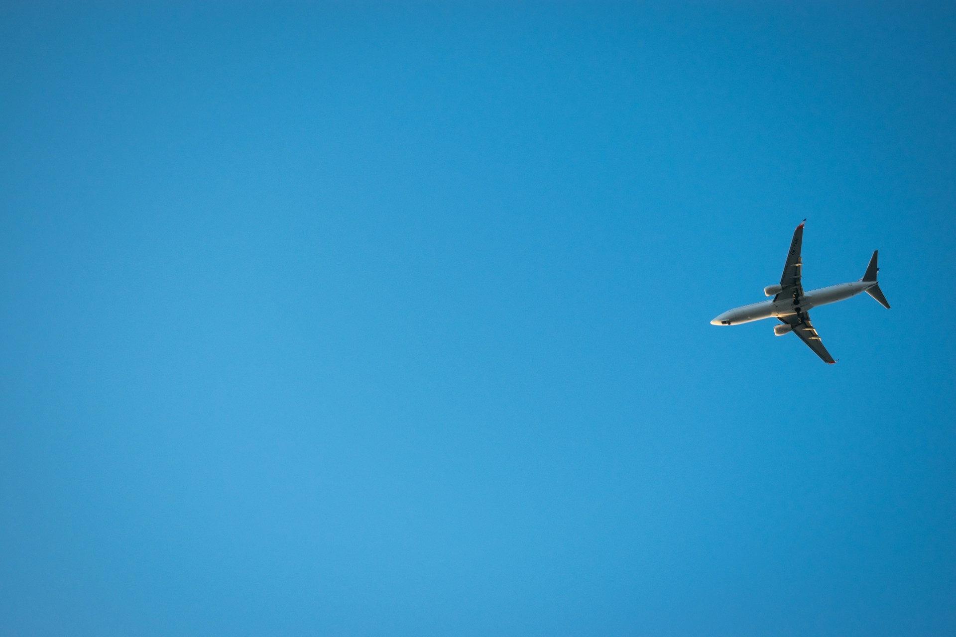 flying white airplane