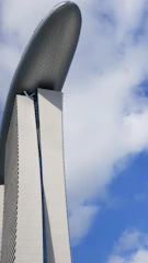 Exterior view of ASV Alexandria showcasing sleek modern architecture under a clear blue sky.