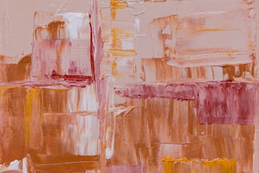 An abstract painting featuring layered brush strokes in a mixture of warm tones such as dusty pink, ochre, and burnt sienna. The textured surface creates a sense of depth and movement across the canvas.