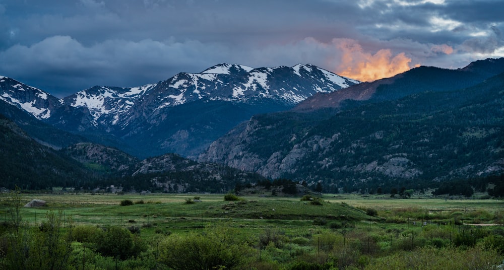 green grass field near mountains