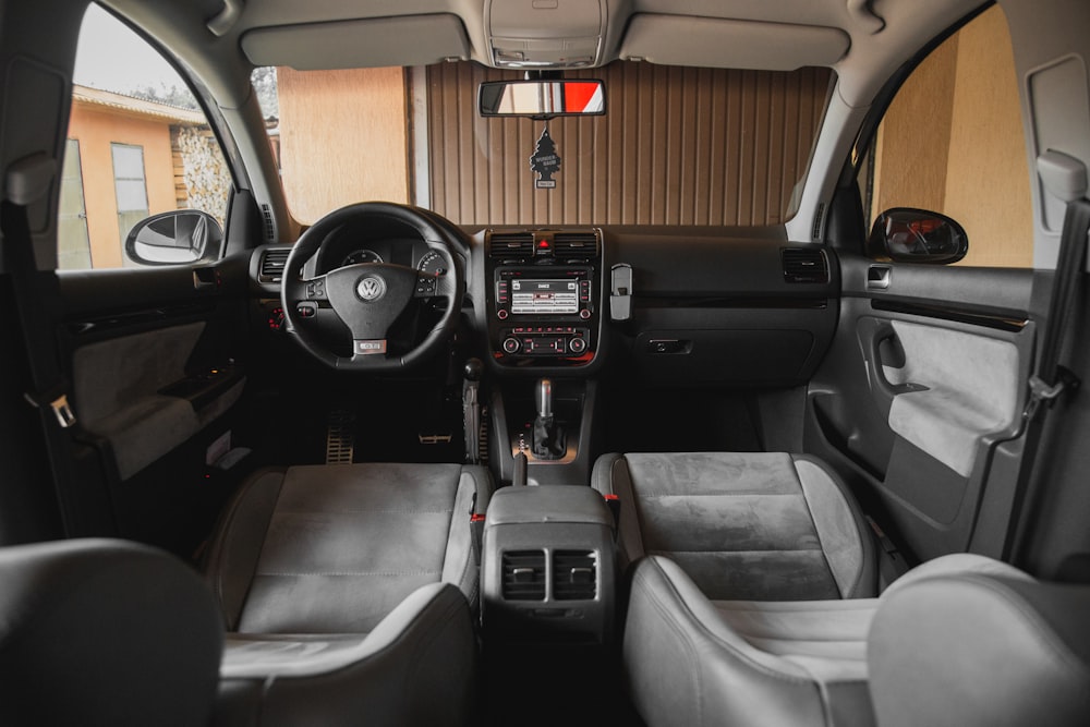 Black Volkswagen Vehicle Interior Near Brown Painted Wall