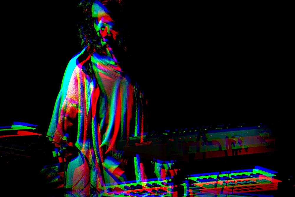 man standing in front DJ controller with photo effect