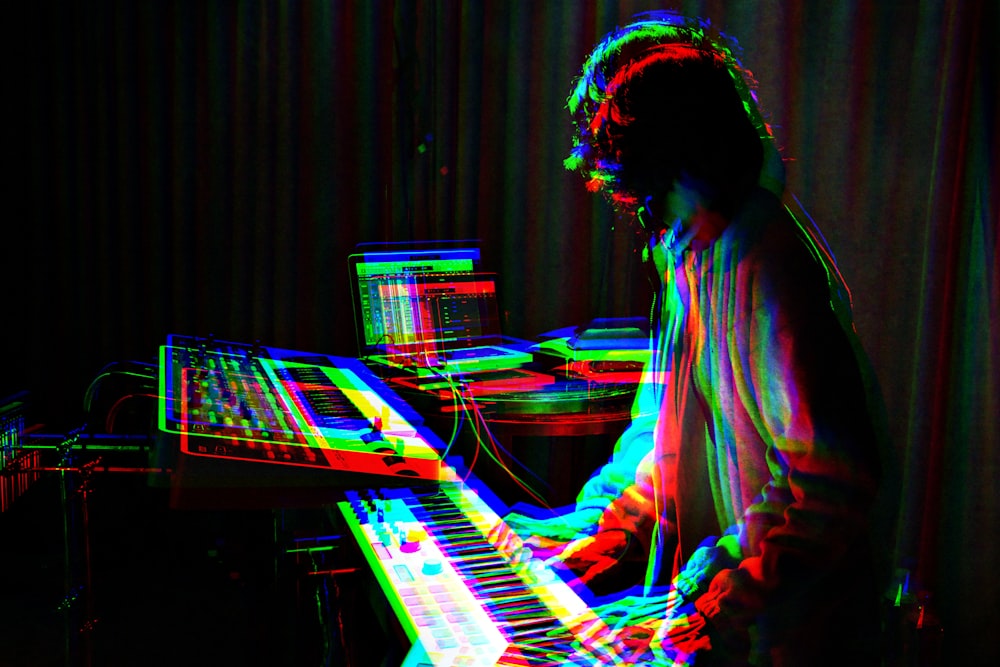 man playing electronic keyboard