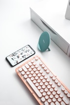 Elegant black and rose gold themed contact desk with a laptop and stylish decor.