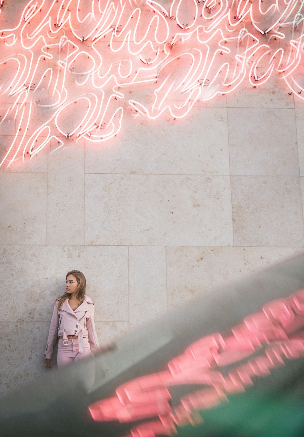 woman leaning on wall