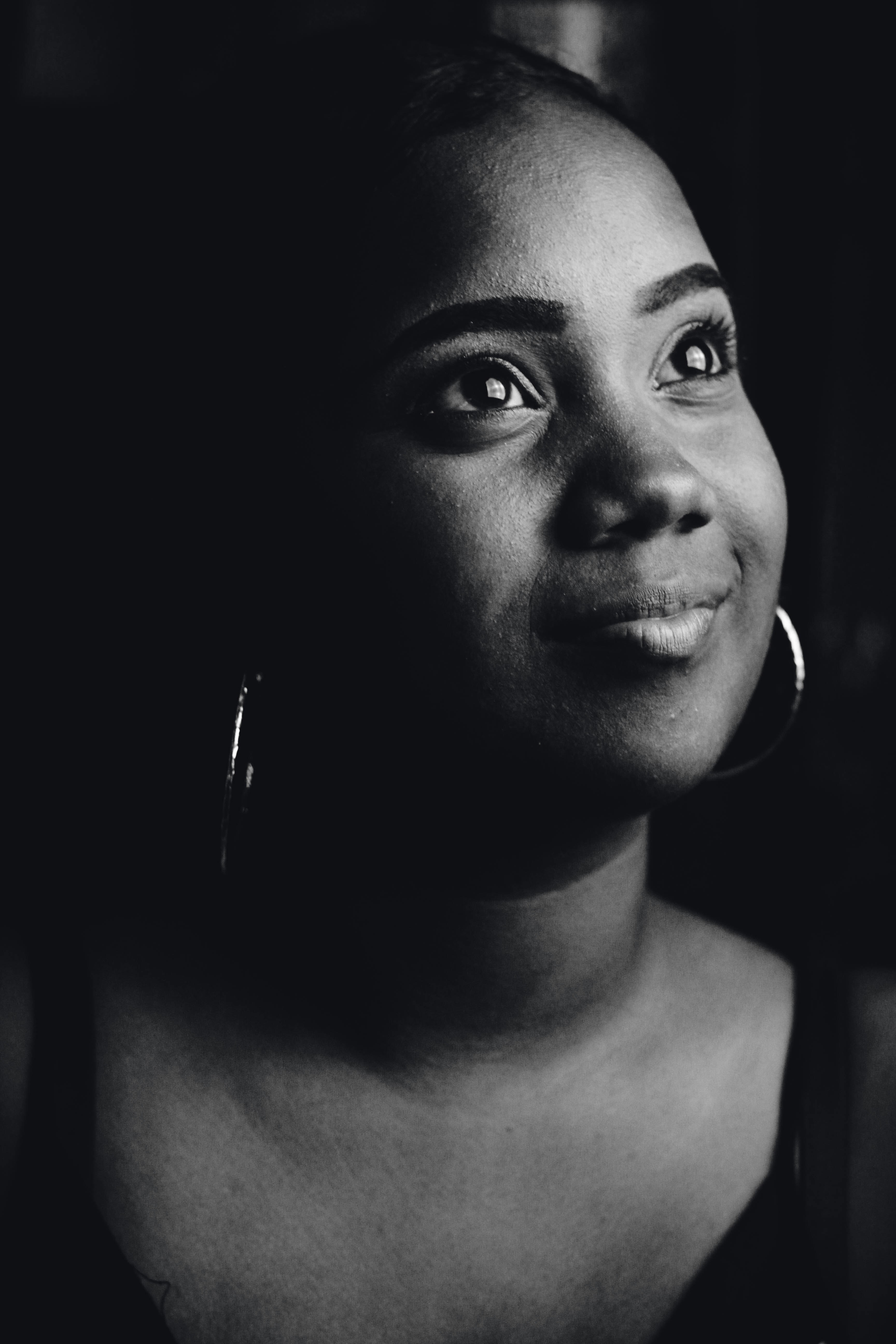 grayscale photo of woman wearing scoop-neck top