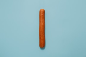 hot dog on teal surface