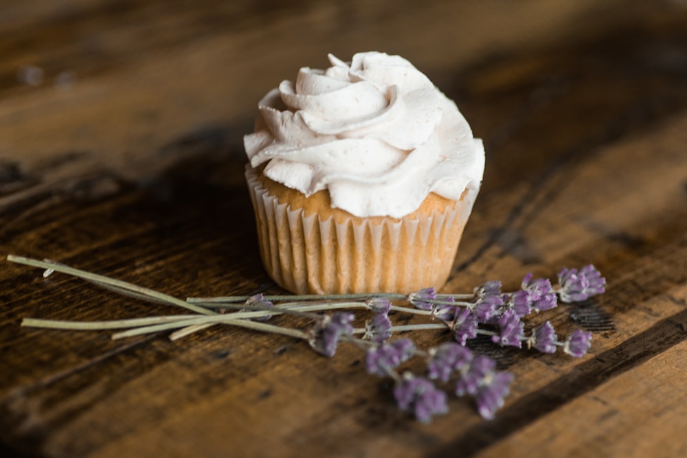 white icing-covered cupcake