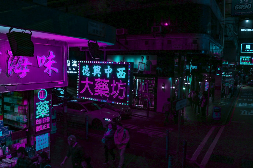 people walking on street during nighttime