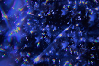 A dark blue background with a lot of small confetti objects