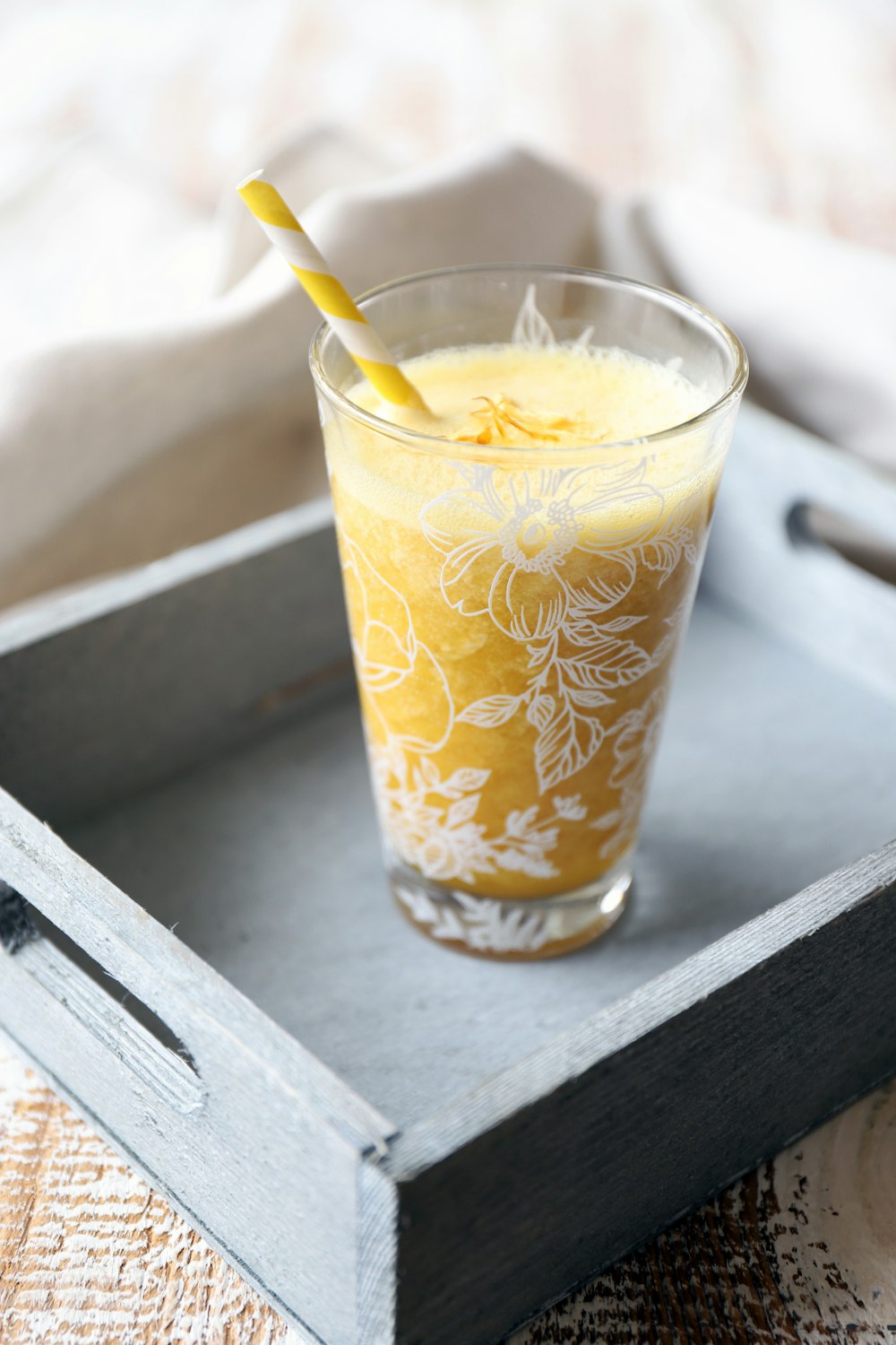 clear highball glass on serving tray