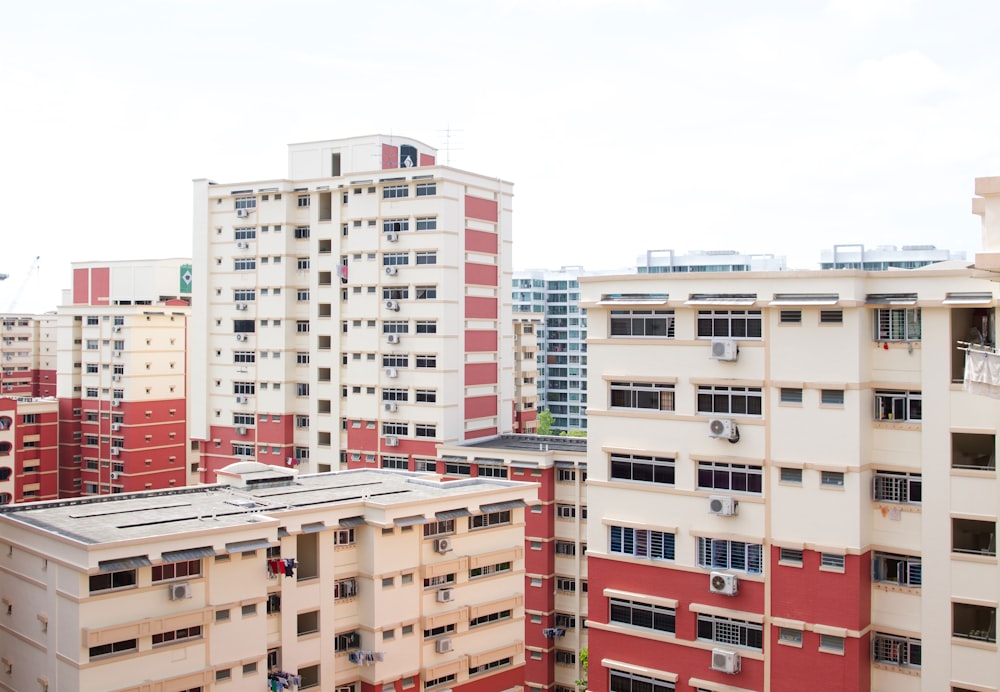 white concrete buildings under white clouds