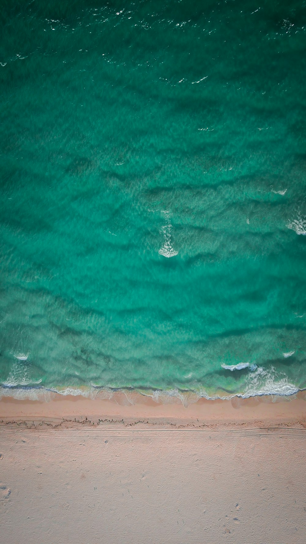aerial photo of green body of water at daytime