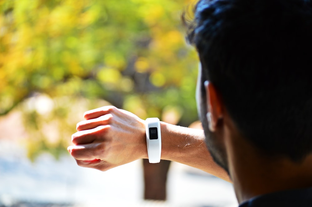 man looking at activity tracker