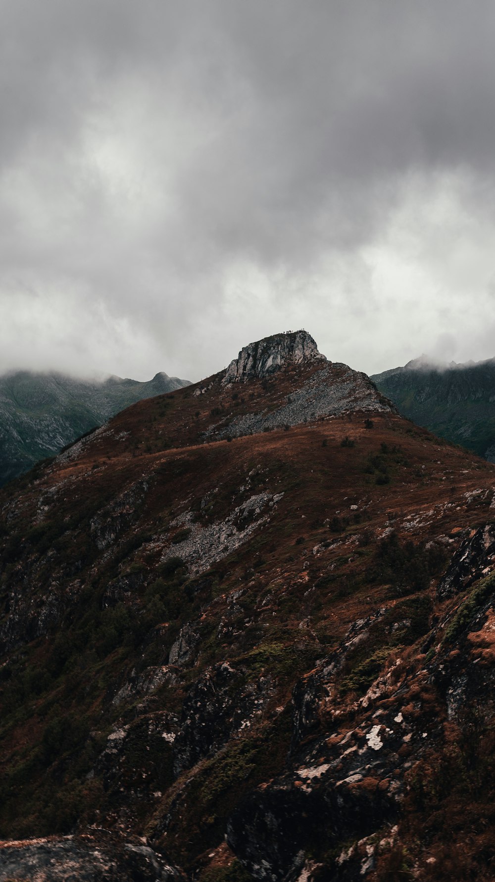 landscape photography of mountain under cloudy sky