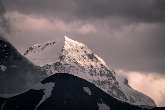 mountain covered by snow under white clouds at daytime in Brienz Switzerland