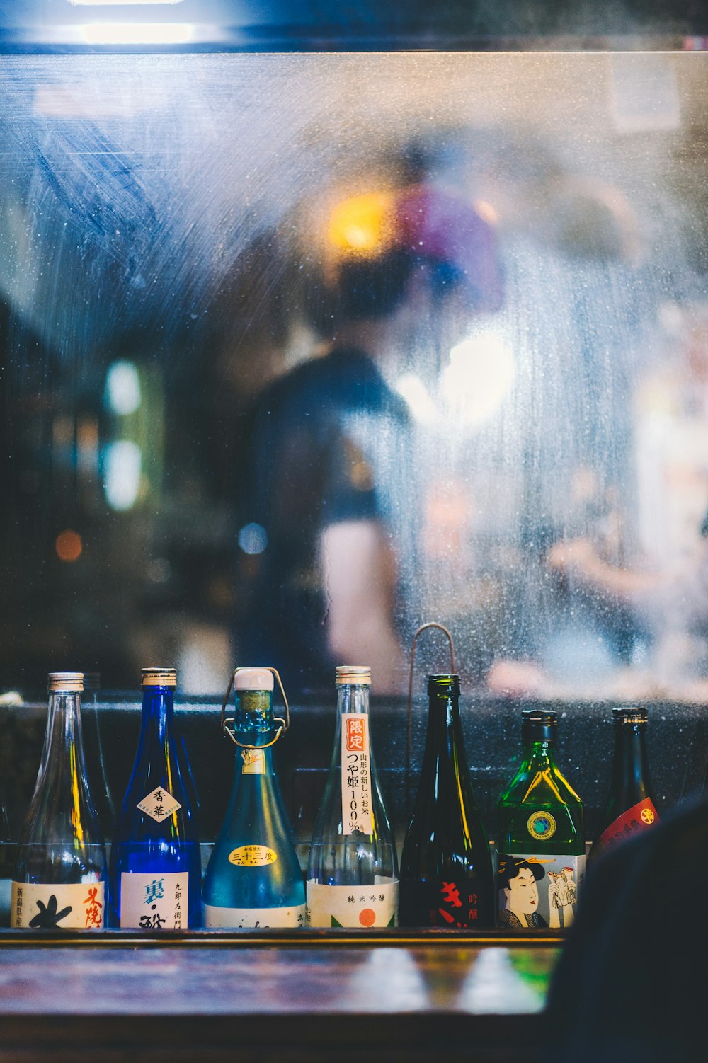 assorted-color bottle on rack