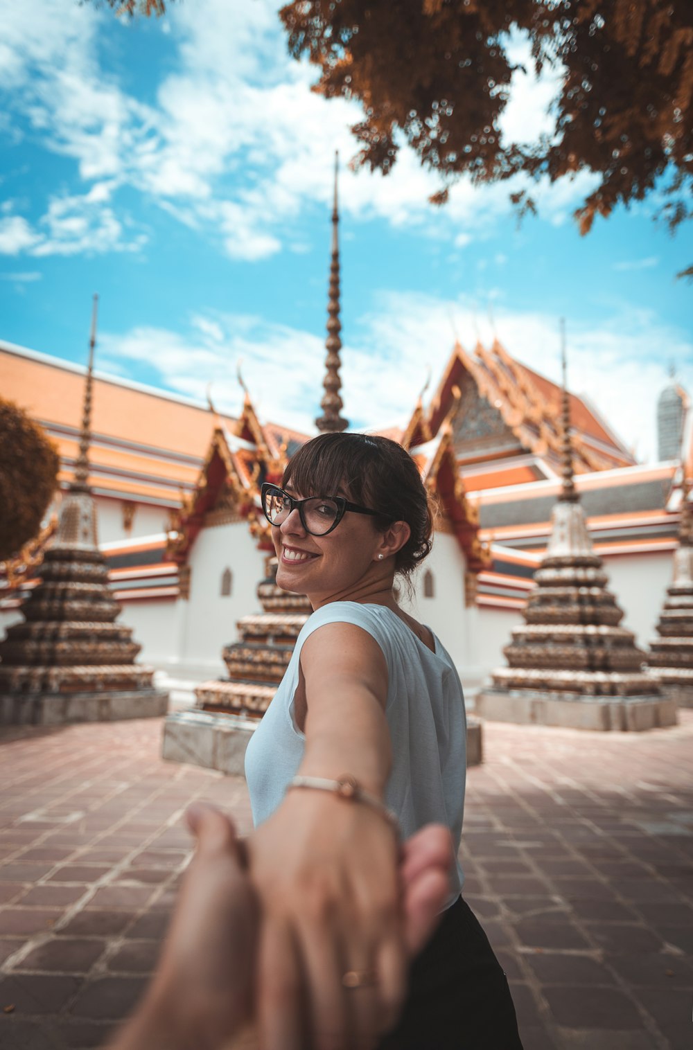 shallow focus photography of smiling woman looking at her back