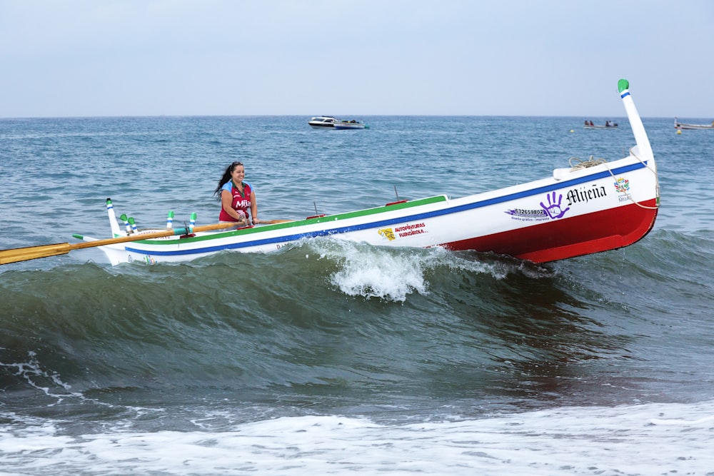 woman riding on white boat