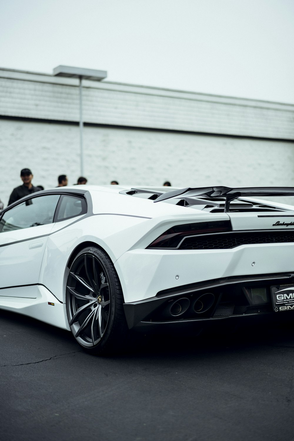 white luxury car on parking lot