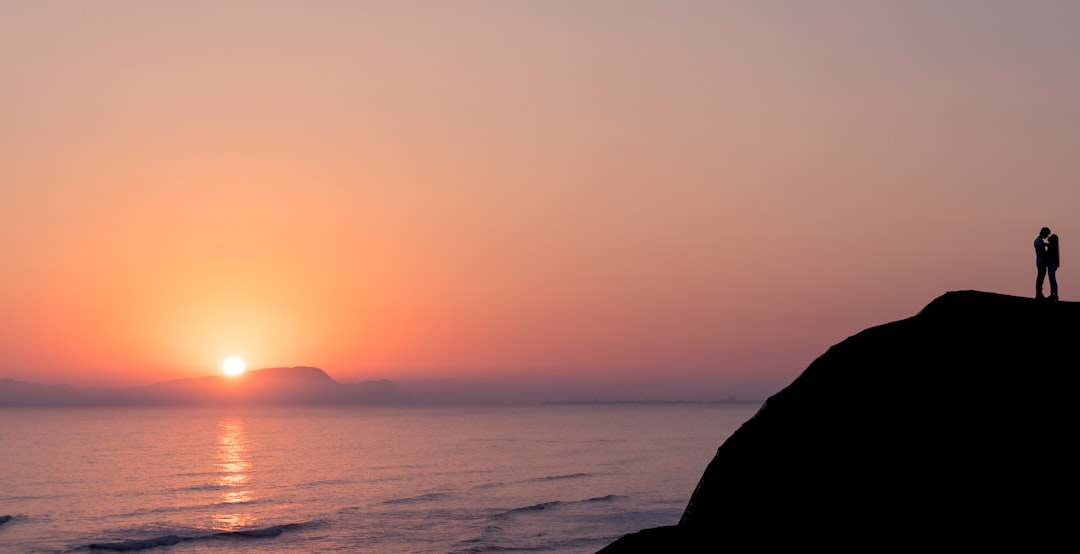 silhouette of man and hill