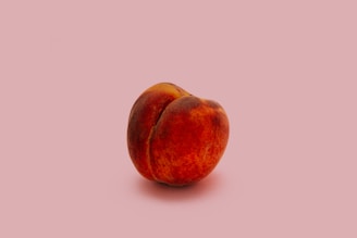 Whole peach symbolizing softness, sensuality, and women’s sexual health