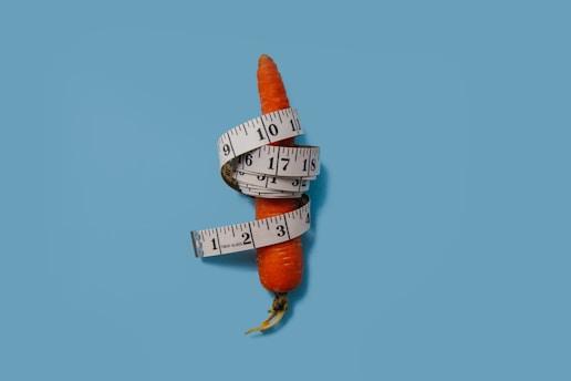 measuring tape wrapped around carrot