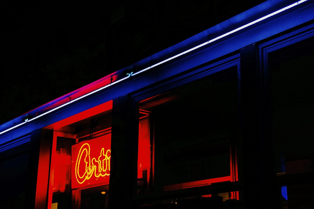 red neon sign turned on, I was on a photojournalism workshop in New York City and we had a photo adventure around Manhat