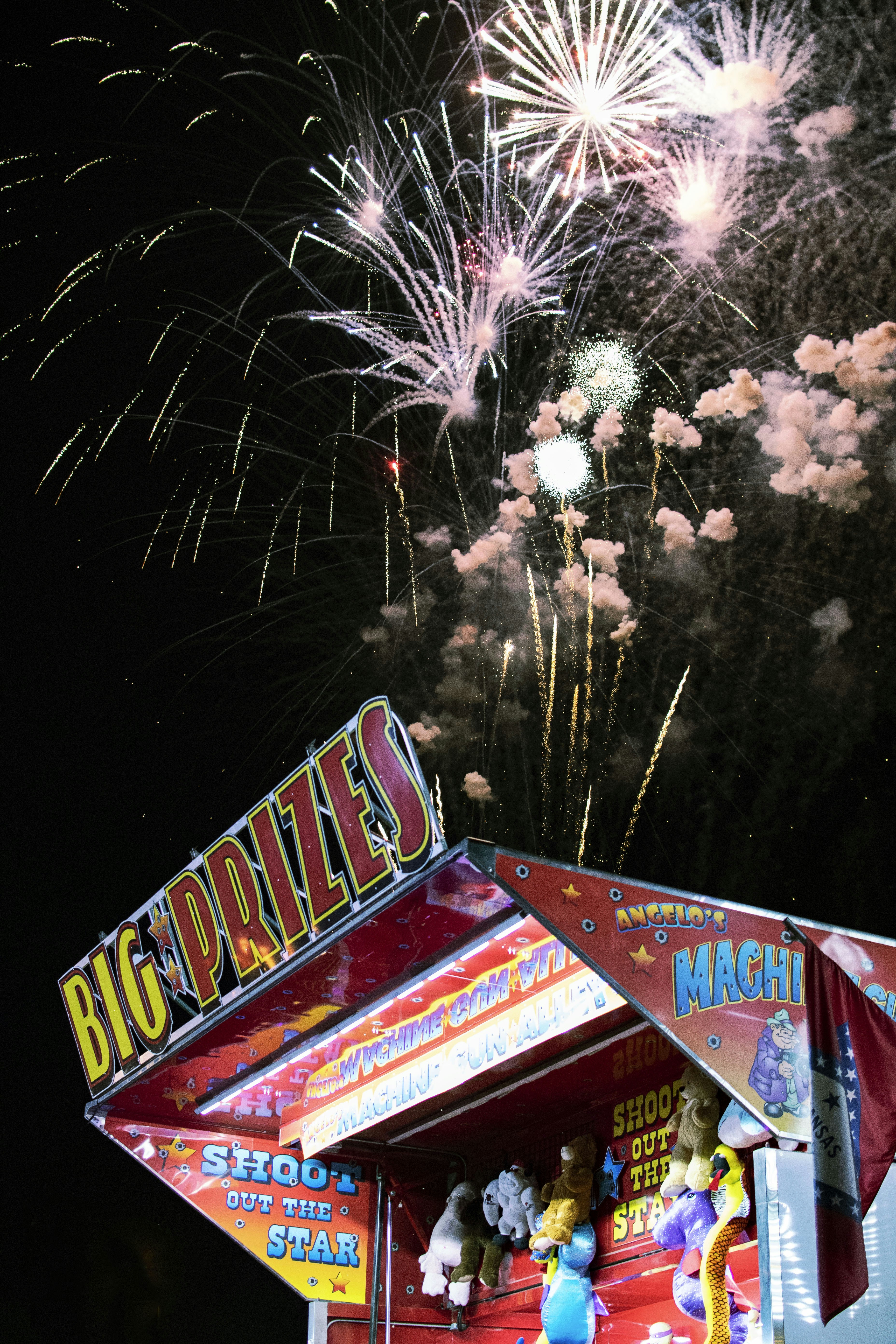 Fairground prizes booth with fireworks
