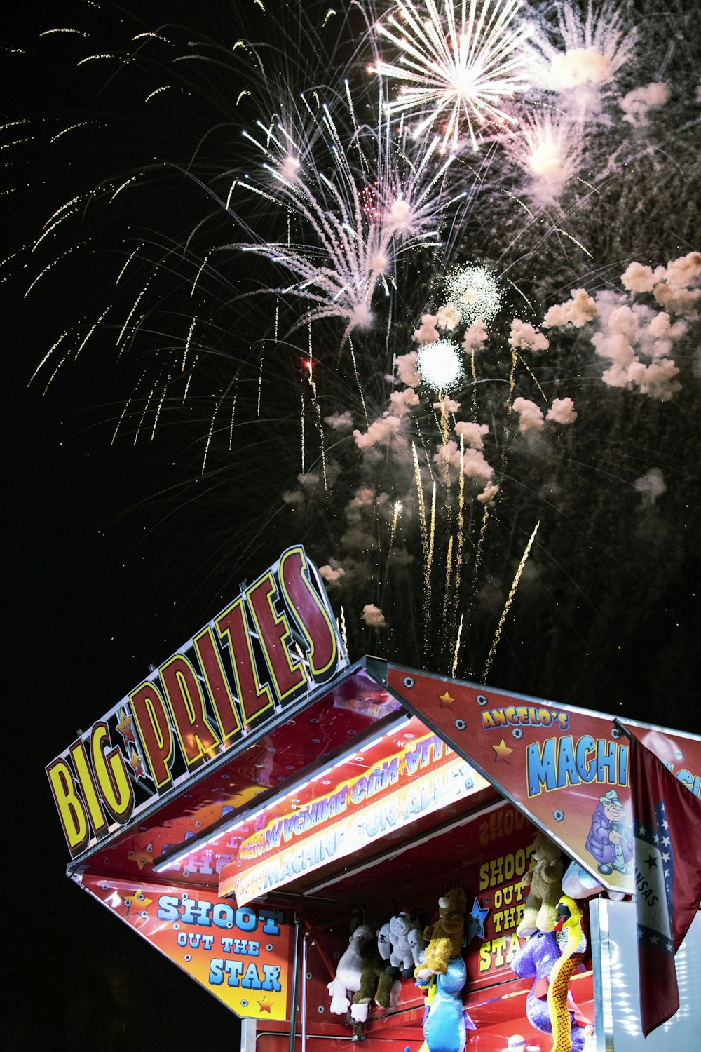 photograph of fireworks over shooting booth