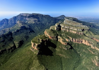 An aerial view of a lush landscape showcasing geological formations.