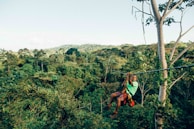 person sliding on zip line