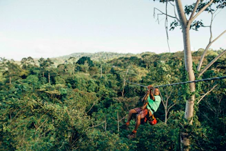 person sliding on zip line