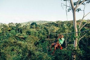 person sliding on zip line