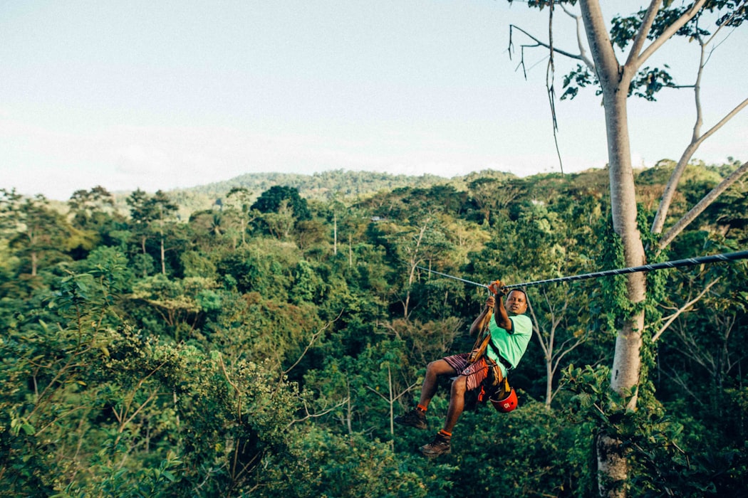 A guy ziplining 