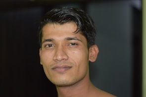 Sharp headshot of a man with subtle retouching highlighting his confident expression.